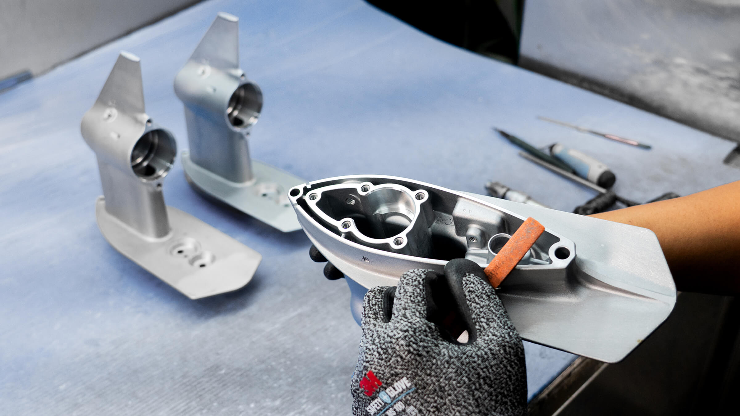 Precision CNC machining and manual finishing of corrosion-resistant aluminum die cast marine outboard motor components at JoinCast’s Taiwan facility.